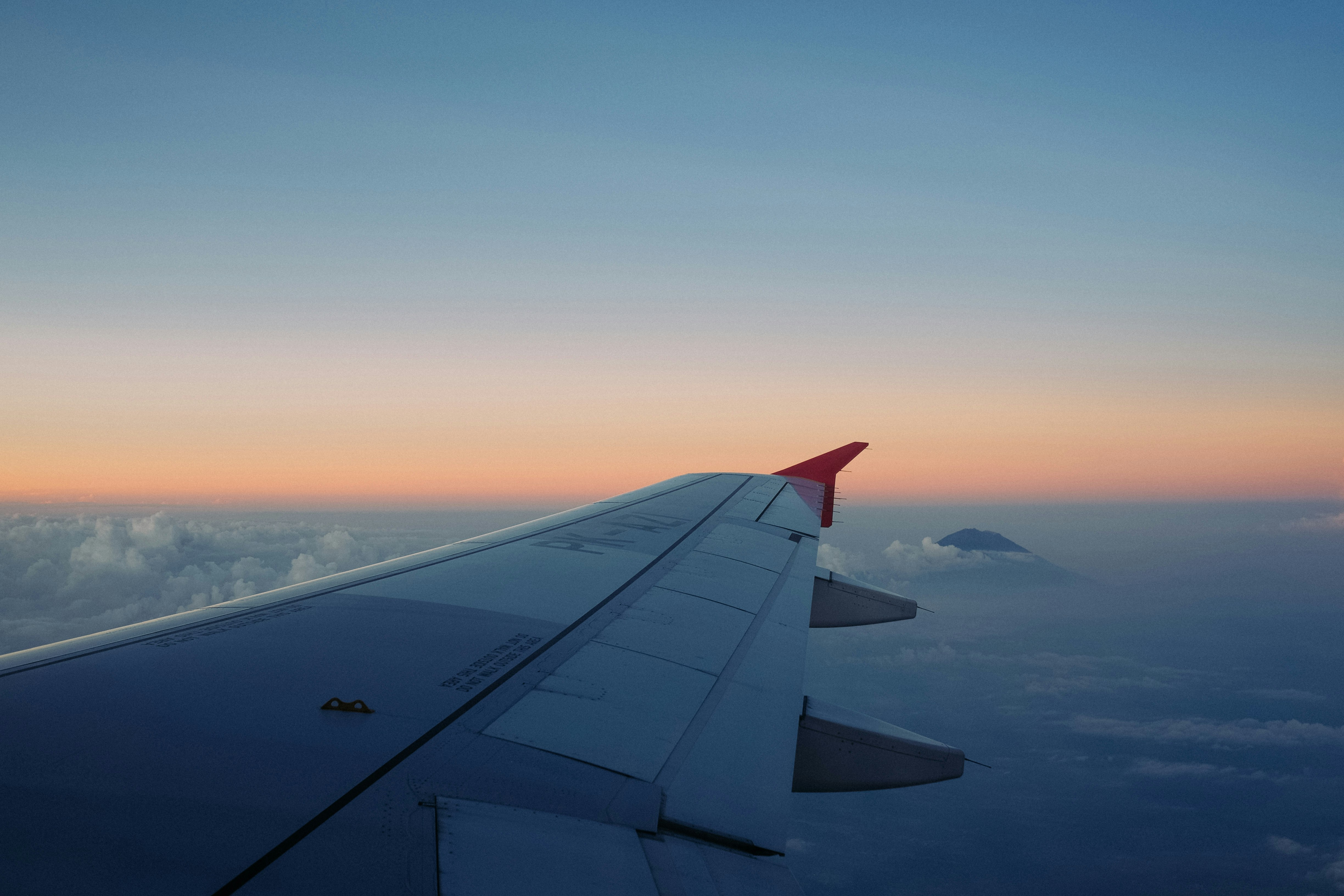 selective focus of airliner wing on the sky